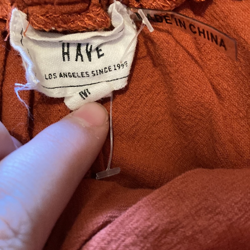HAVE size M orange shorts.